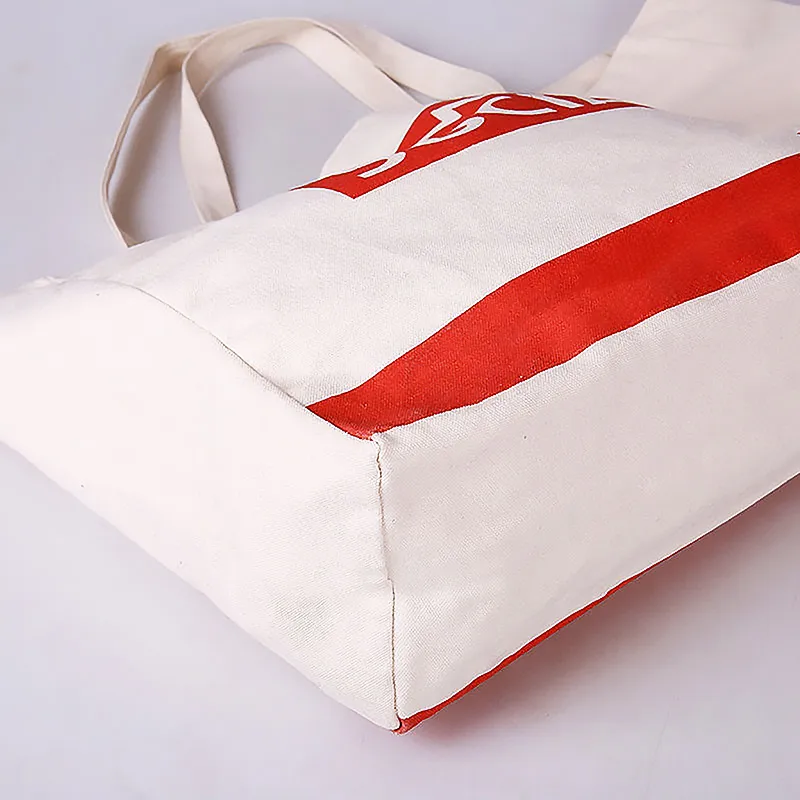 white canvas bag with red logo